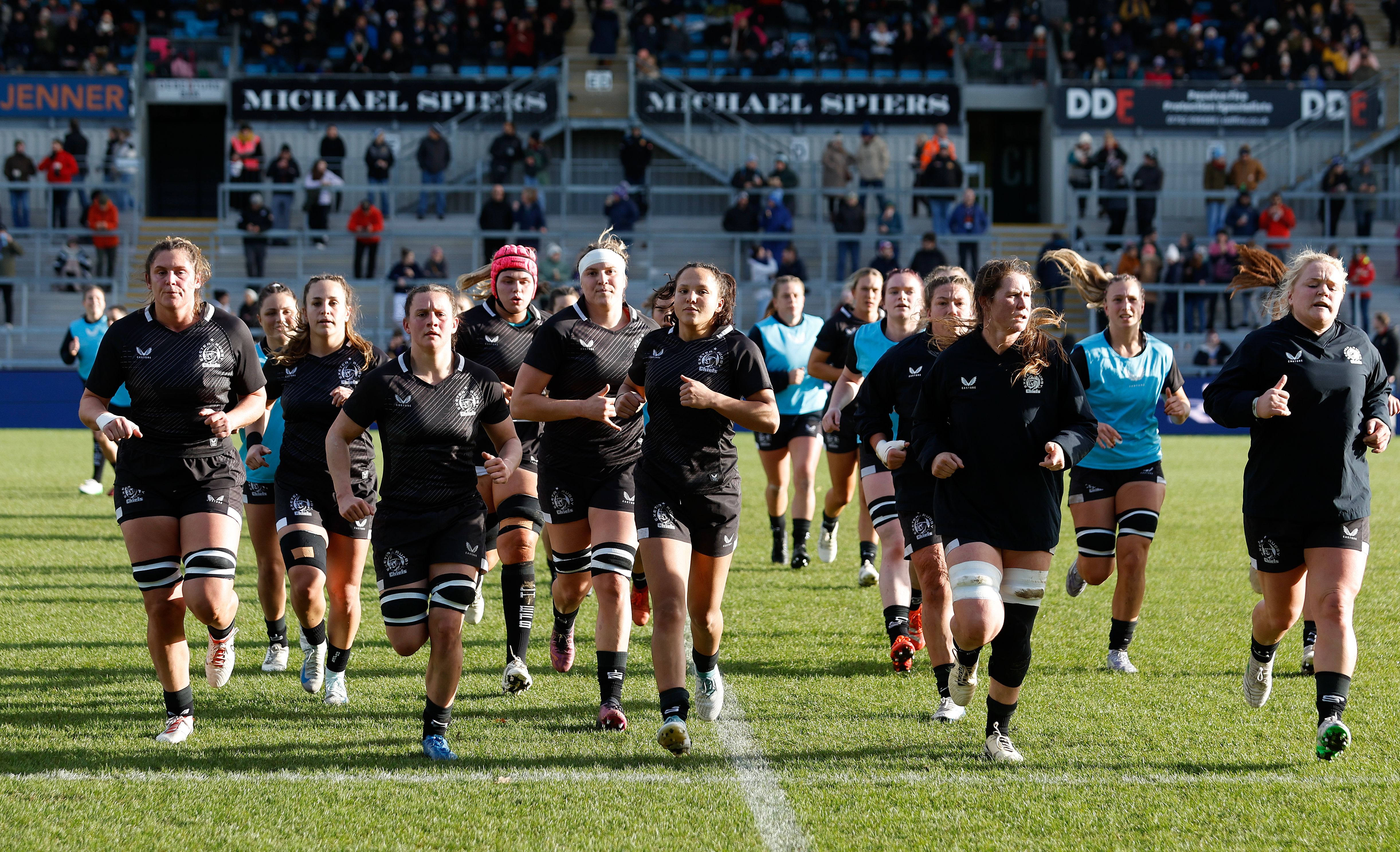 Women's team running in